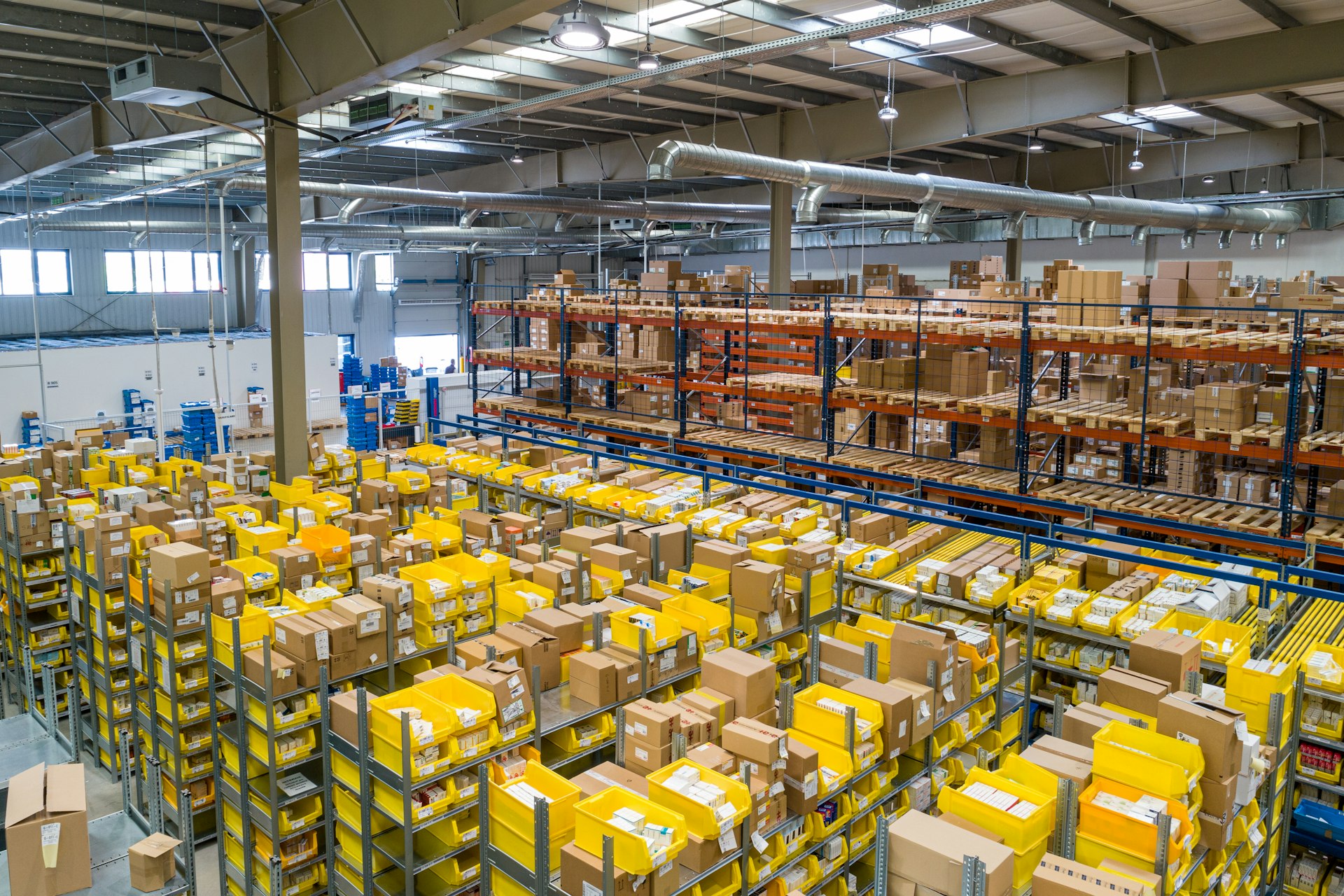 Cargo vans and box trucks at a logistics distribution dock